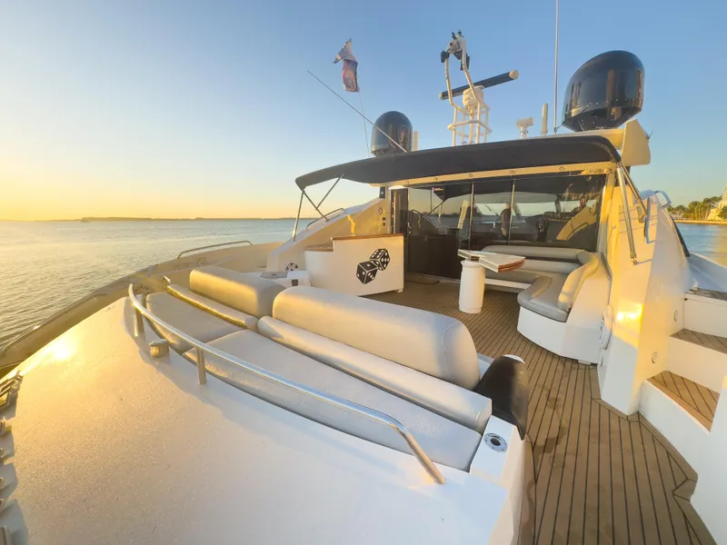 Slide: The Image of Sunseeker Predator 82 yacht, 2006 model, with spacious deck at sunset. - 13