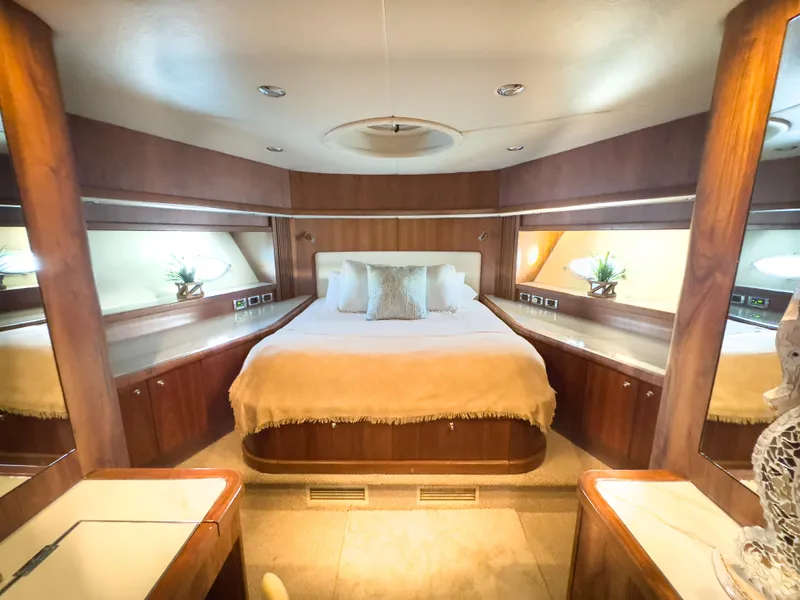 Slide: The Image of Luxurious bedroom interior of 2006 Sunseeker Predator 82 yacht with elegant wood finishes. - 17
