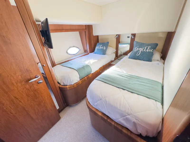 Slide: The Image of Twin cabin interior of 2006 Sunseeker Predator 82 yacht with cozy beds and decor. - 18