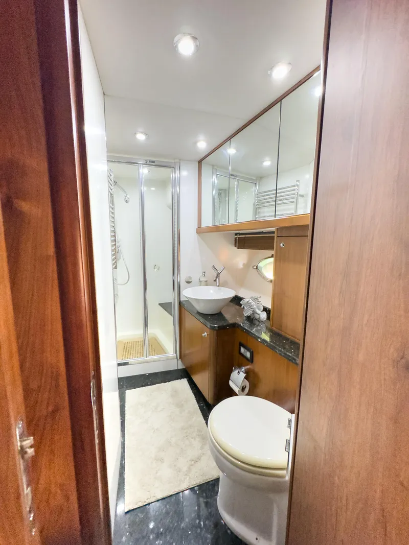 Slide: The Image of Luxurious bathroom in 2006 Sunseeker Predator 82 yacht with modern fixtures and shower. - 19