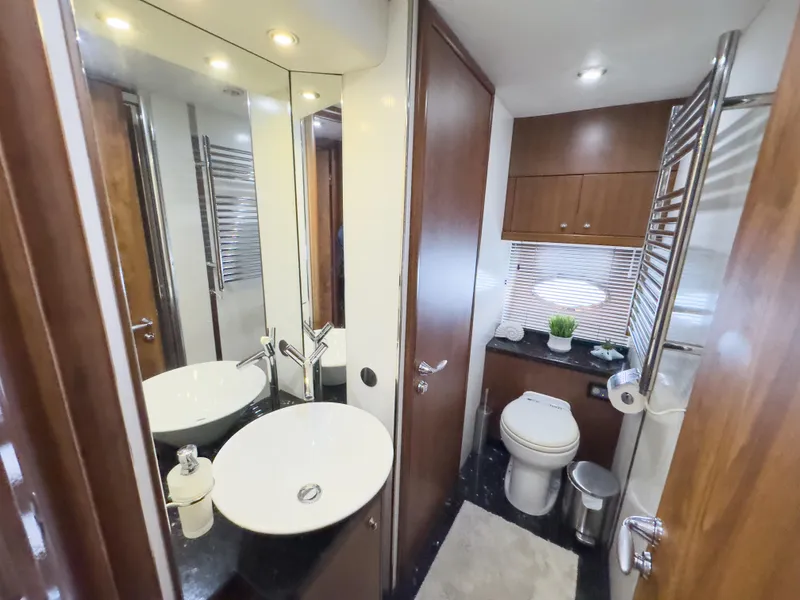 Slide: The Image of Luxurious bathroom in 2006 Sunseeker Predator 82 yacht with modern fixtures and elegant design. - 21