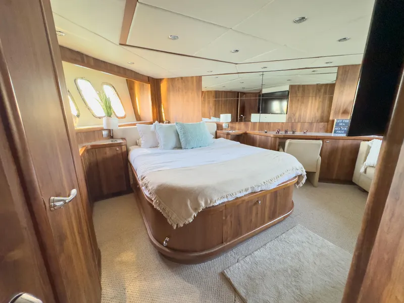 Slide: The Image of Luxurious bedroom interior of 2006 Sunseeker Predator 82 yacht with wood paneling. - 22