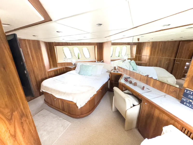 Slide: The Image of Luxurious cabin interior of 2006 Sunseeker Predator 82 yacht with wood paneling and comfortable bedding. - 23
