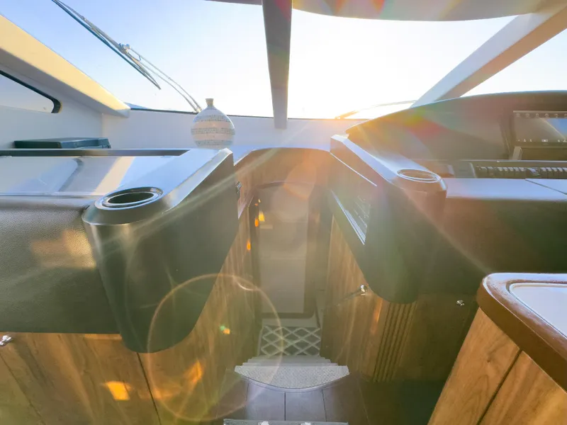 Slide: The Image of Interior view of 2006 Sunseeker Predator 82 yacht with sunlight streaming through windows. - 25
