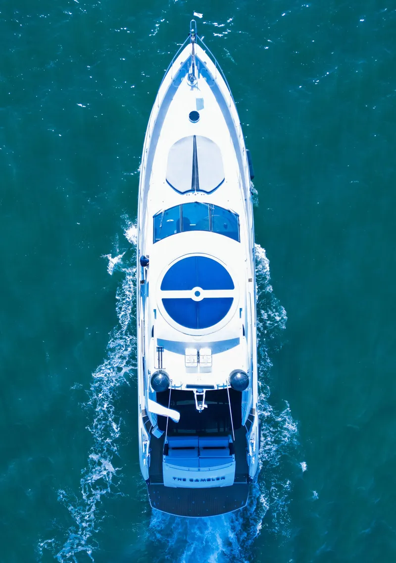 Slide: The Image of Sunseeker Predator 82 yacht cruising on open water, aerial view, 2006 model. - 4