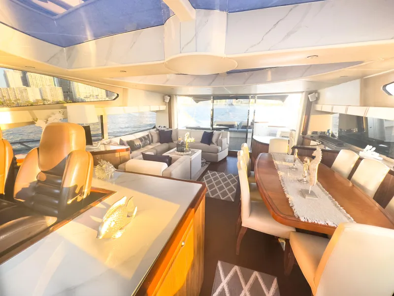 Slide: The Image of Luxurious interior of a 2006 Sunseeker Predator 82 yacht with elegant seating and dining area. - 6