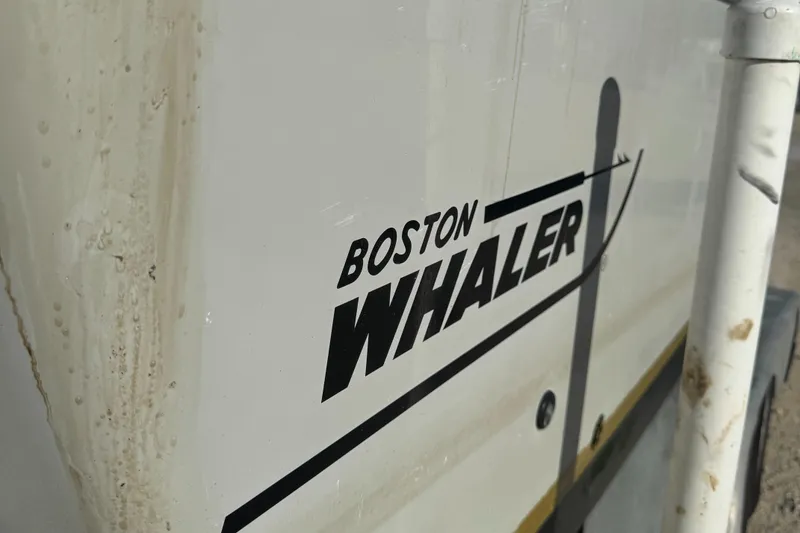 Slide: The Image of Close-up of 2005 Boston Whaler Justice 240 boat logo on hull. - 4