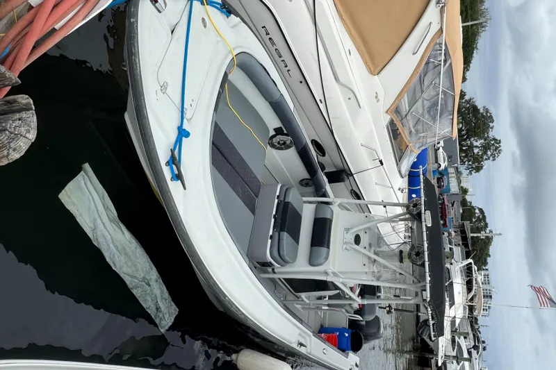 Slide: The Image of 2005 Boston Whaler Justice 240 docked at marina, featuring sleek design and comfortable seating. - 6