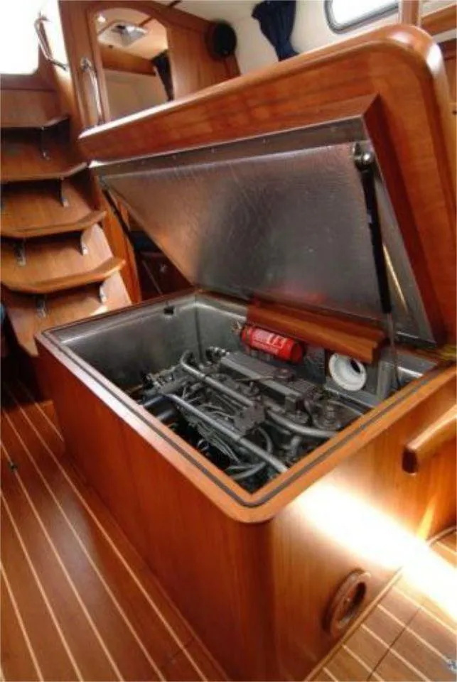 Slide: The Image of Engine compartment of 2025 Rustler 42 yacht with wooden interior and open hatch. - 25