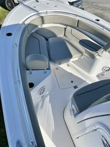 Slide: The Image of 2025 Sportsman Heritage 231 boat on trailer, blue hull, parked outdoors. - 11