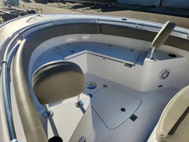Slide: The Image of 2025 Sportsman Heritage 231 boat interior with seating and cup holders. - 13