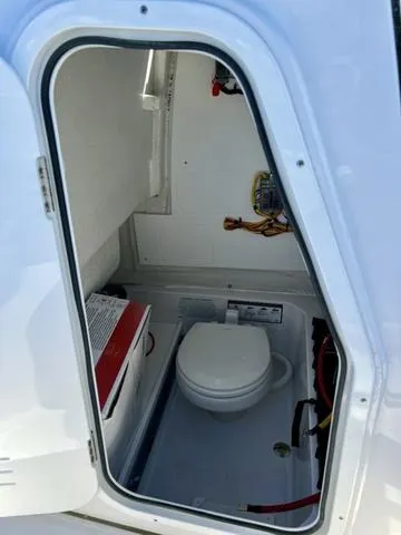 Slide: The Image of Steering wheel of 2025 Sportsman Heritage 231 boat, featuring modern controls and dashboard. - 17