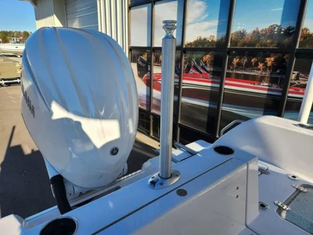 Slide: The Image of 2025 Sportsman Heritage 231 boat with outboard motor and sleek design. - 20