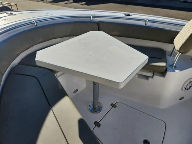 Slide: The Image of 2025 Sportsman Heritage 231 boat interior with seating and table. - 25