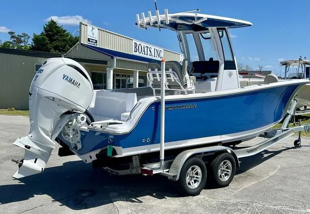 Slide: The Image of 2025 Sportsman Heritage 231 boat interior with cushioned seating and storage compartments. - 3