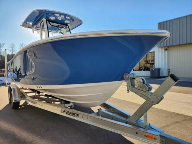 Slide: The Image of 2025 Sportsman Heritage 231 boat with cushioned seating and modern design. - 8