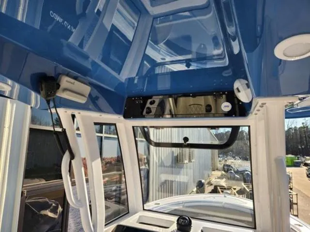 Slide: The Image of 2025 Sportsman Heritage 231 boat with Yamaha outboard motor, docked at marina. - 9