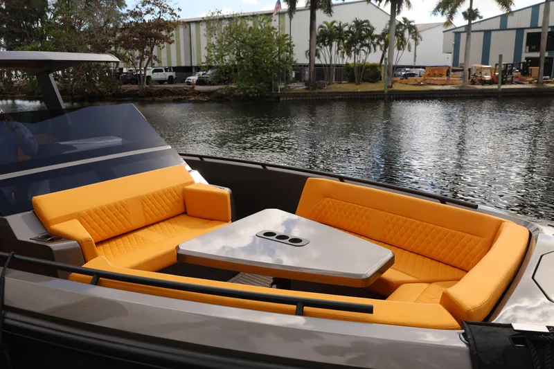 Slide: The Image of Luxurious 2021 Vanquish Yachts VQ40 with vibrant orange seating and sleek design. - 14