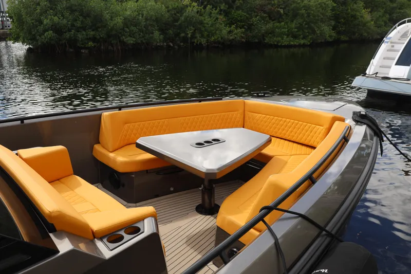 Slide: The Image of Luxurious 2021 Vanquish Yachts VQ40 with vibrant orange seating and sleek design. - 15