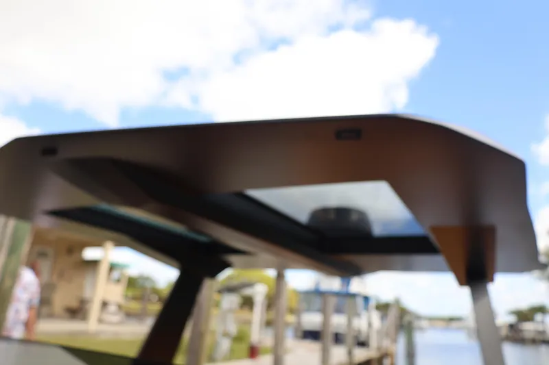 Slide: The Image of Vanquish Yachts VQ40 2021, sleek design, docked by waterfront. - 28