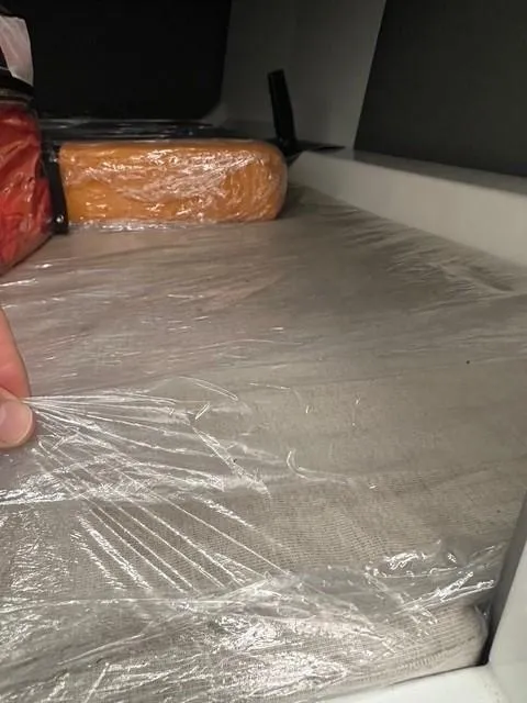 Slide: The Image of Interior storage area of 2021 Vanquish Yachts VQ40, wrapped in protective plastic. - 31