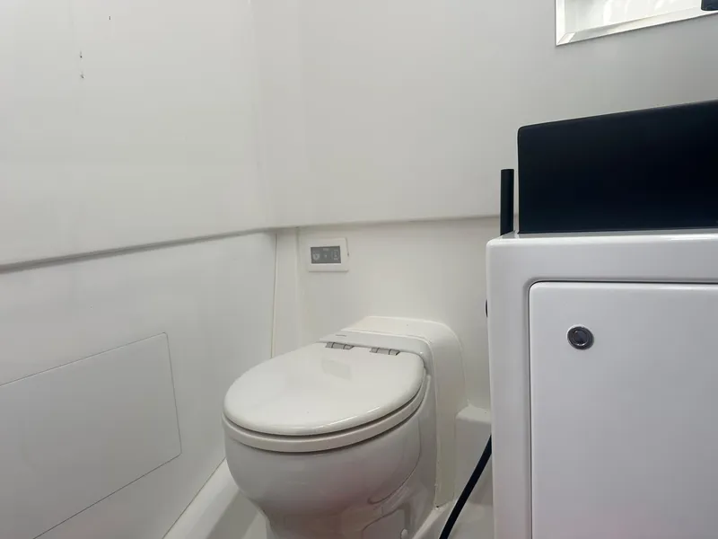 Slide: The Image of Modern bathroom interior of 2021 Vanquish Yachts VQ40, featuring sleek design and compact toilet. - 32