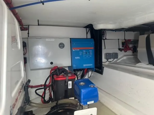 Slide: The Image of Electrical system inside 2021 Vanquish Yachts VQ40, featuring battery and control panel. - 33