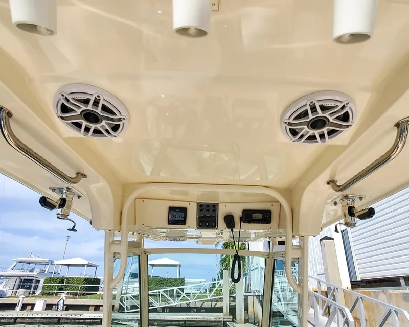 Slide: The Image of 2017 Scout 275 LXF boat interior with speakers and control panel. - 2
