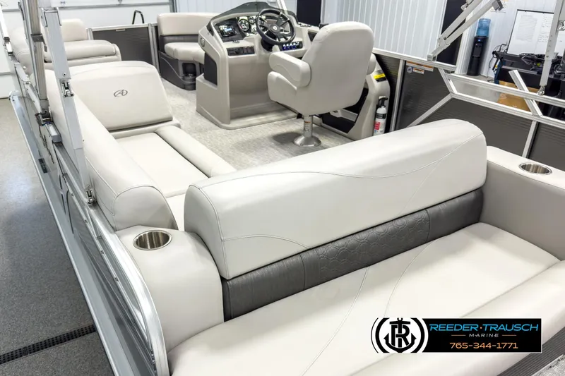 Slide: The Image of 2020 Avalon 2285 LSZ CRB pontoon boat interior with beige seating and steering console. - 11