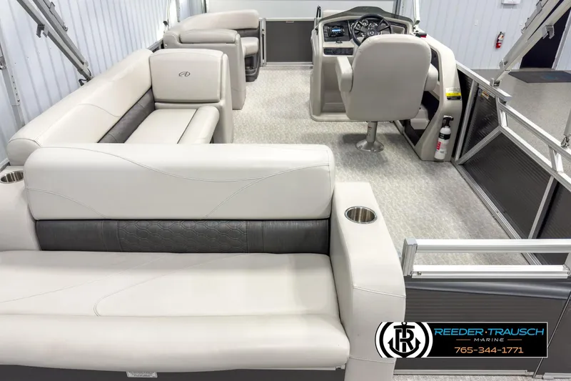 Slide: The Image of 2020 Avalon 2285 LSZ CRB pontoon boat interior with plush seating and steering console. - 16