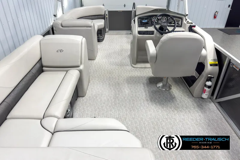 Slide: The Image of 2020 Avalon 2285 LSZ CRB pontoon boat interior with plush seating and modern helm. - 17