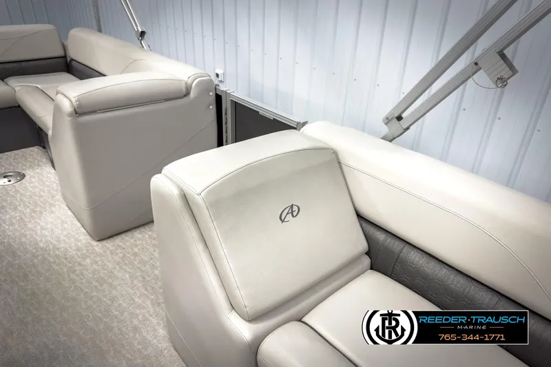 Slide: The Image of 2020 Avalon 2285 LSZ CRB boat interior with plush seating and logo. - 21