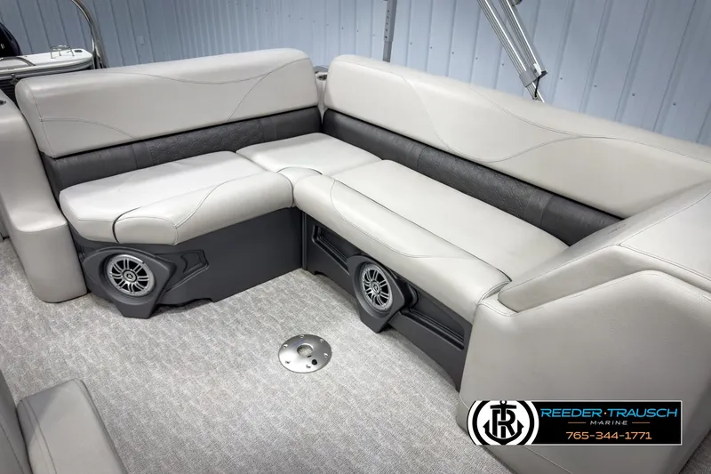 Slide: The Image of 2020 Avalon 2285 LSZ CRB boat interior with gray seating and built-in speakers. - 23