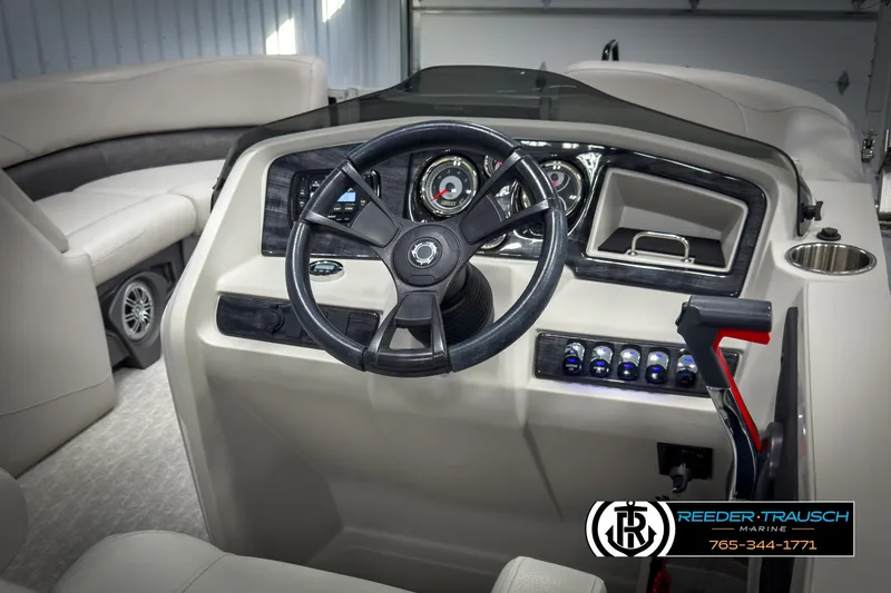 Slide: The Image of 2020 Avalon 2285 LSZ CRB boat dashboard with steering wheel and controls. - 25