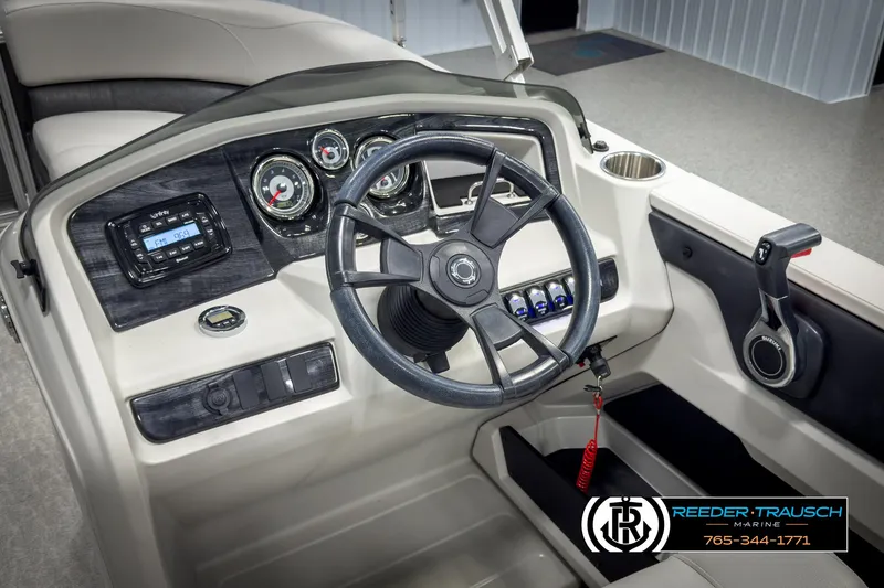 Slide: The Image of 2020 Avalon 2285 LSZ CRB boat dashboard with steering wheel and control panel. - 26
