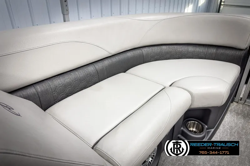 Slide: The Image of 2020 Avalon 2285 LSZ CRB boat interior with plush seating and cup holder. - 34