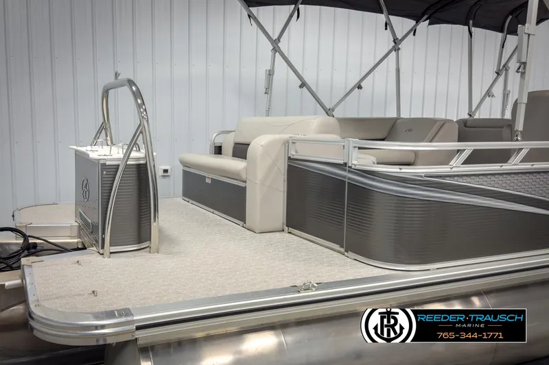 Slide: The Image of 2020 Avalon 2285 LSZ CRB pontoon boat with seating, docked indoors. - 44