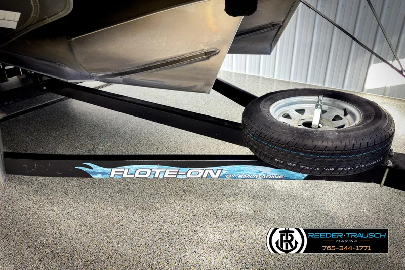 Slide: The Image of 2020 Avalon 2285 LSZ CRB on Flote-On trailer with spare tire, Reeder-Trausch Marine branding. - 46