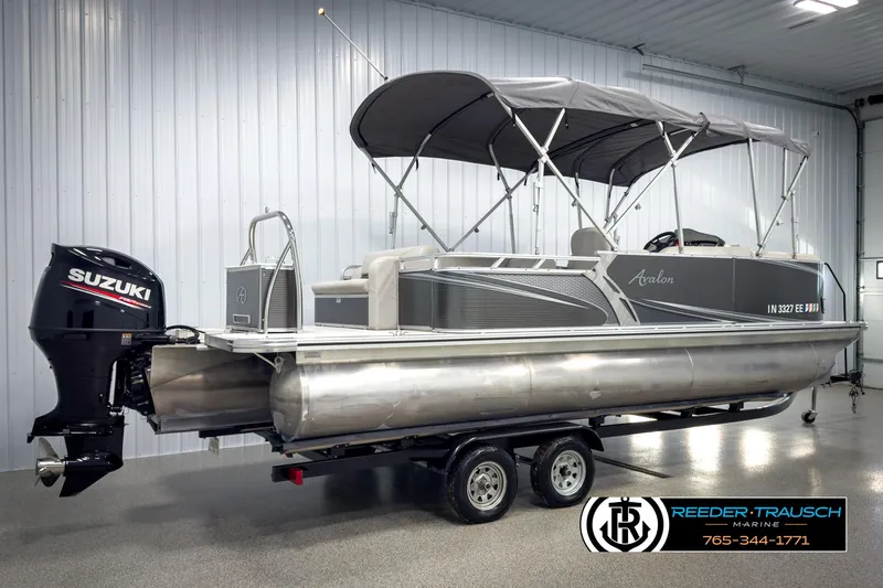 Slide: The Image of 2020 Avalon 2285 LSZ CRB pontoon boat with Suzuki outboard motor in showroom. - 6