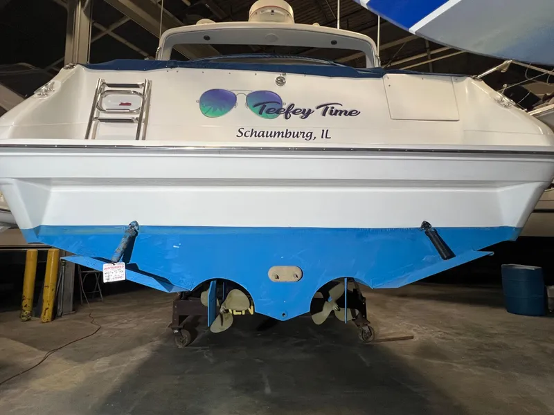 Slide: The Image of 1992 Sea Ray 370 Express Cruiser in a garage, named "Teeley Time," Schaumburg, IL. - 13