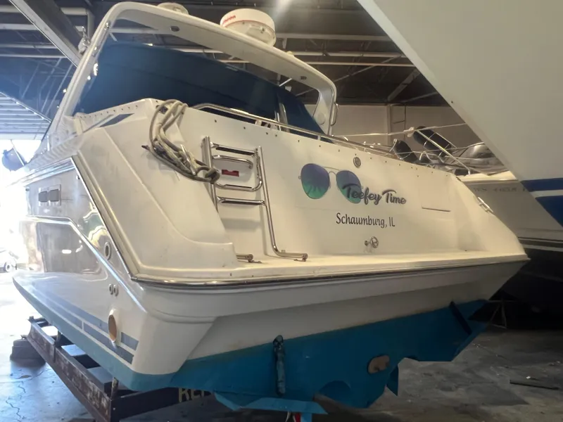 Slide: The Image of 1992 Sea Ray 370 Express Cruiser in a boatyard, rear view. - 3