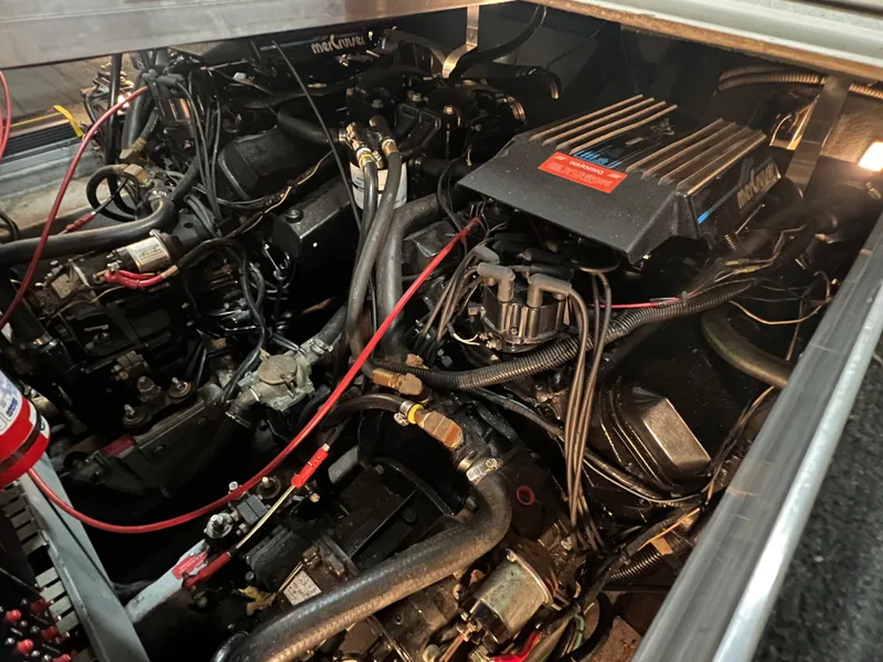 Slide: The Image of Engine compartment of a 1992 Sea Ray 370 Express Cruiser, showcasing detailed mechanical components. - 32