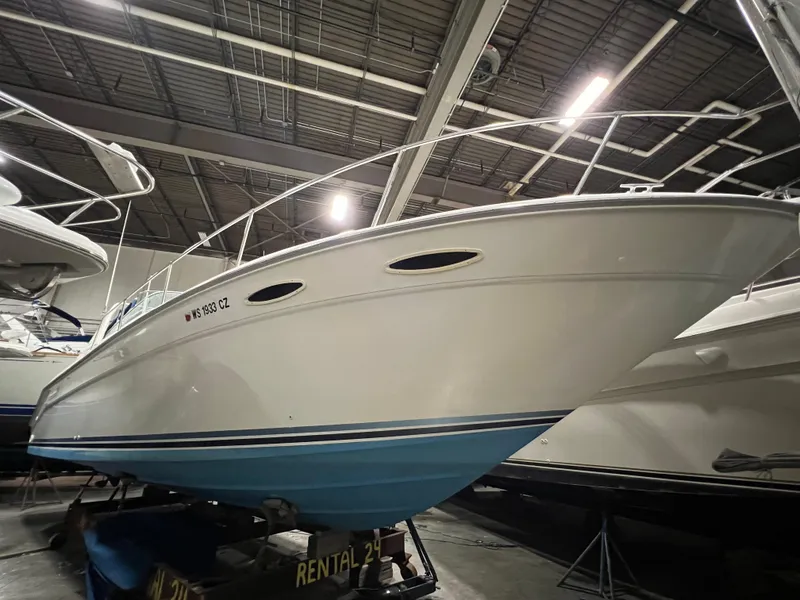 Slide: The Image of 1992 Sea Ray 370 Express Cruiser in indoor storage, side view. - 4