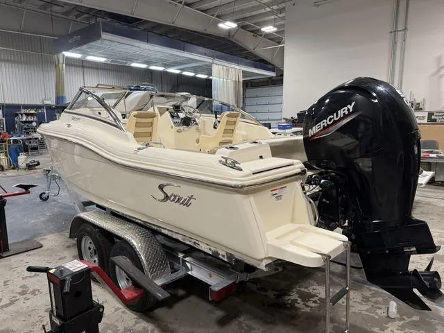 Slide: The Image of 2021 Scout 210 Dorado boat on trailer in a workshop with Mercury outboard motor. - 3