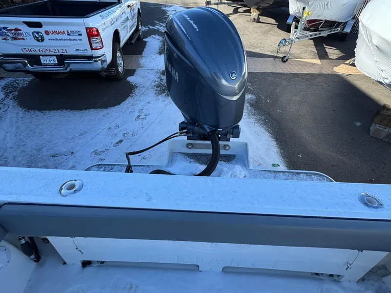 Slide: The Image of Defiance Admiral 220 EX 2025 boat with Yamaha outboard motor in a marina setting. - 10