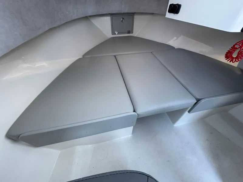 Slide: The Image of 2025 Defiance Admiral 220 EX boat interior with cushioned seating. - 8