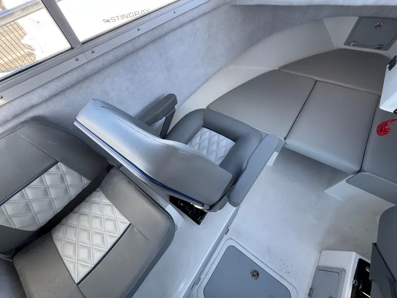 Slide: The Image of Interior of 2025 Defiance Admiral 220 EX boat with gray seating and modern design. - 5
