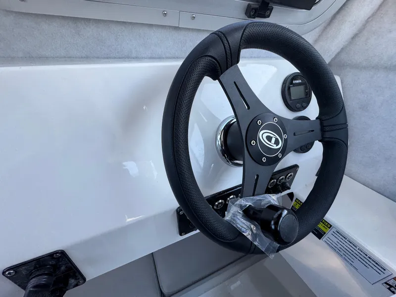 Slide: The Image of Steering wheel of 2025 Defiance Admiral 220 EX boat interior. - 7
