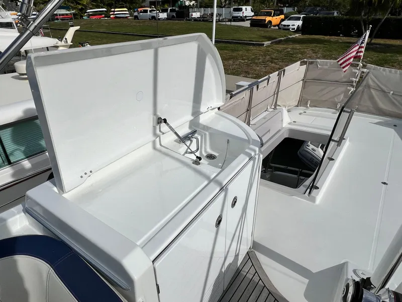 Slide: The Image of 2019 Beneteau Swift Trawler 44 deck with outdoor sink and seating area. - 10