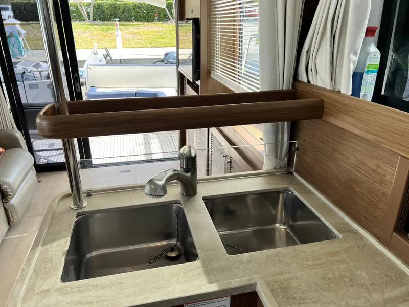 Slide: The Image of 2019 Beneteau Swift Trawler 44 kitchen with dual sinks and modern fixtures. - 16